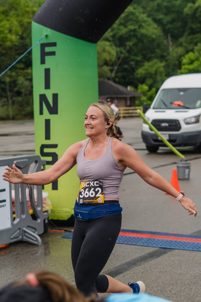 Chelsea Febinger crosses the finish line at the 4.12 Miler race